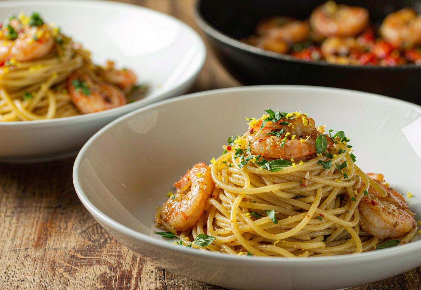 Linguine tossed with garlic oil and pink shrimp finished with parsley and lemon