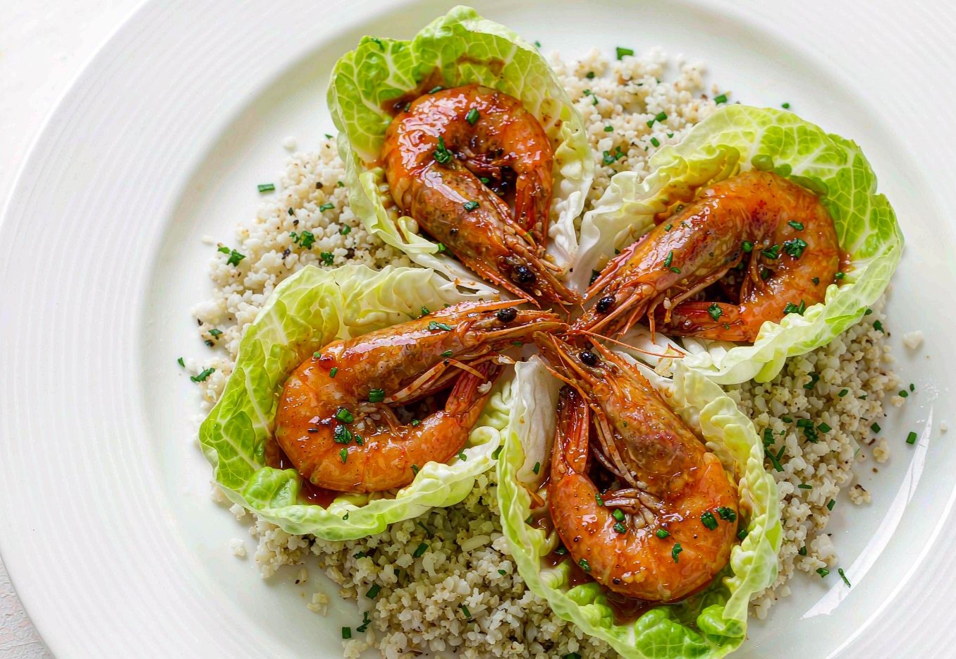 Garlic shrimp in butter lettuce cups over seasoned cauliflower rice
